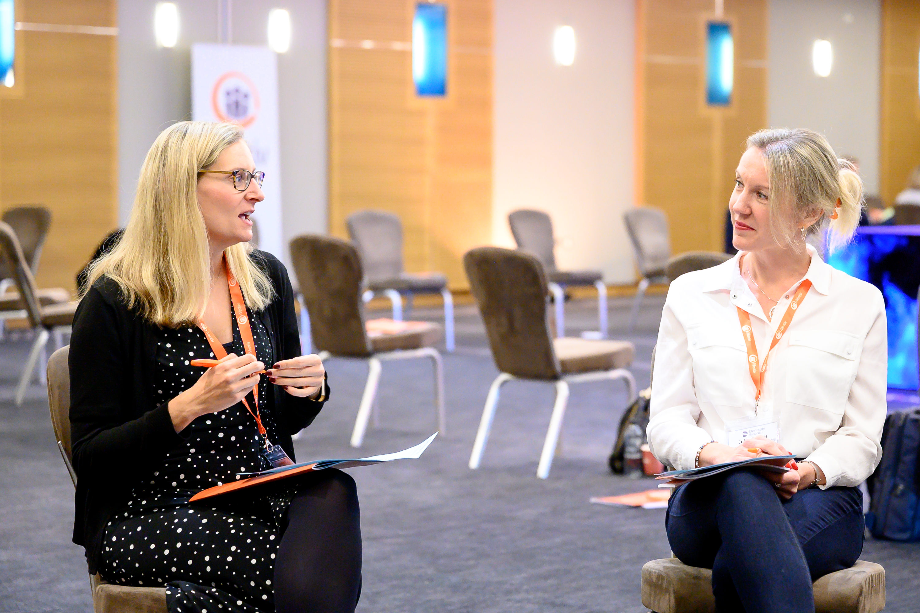 Two participants in conversation at an iVentiv event